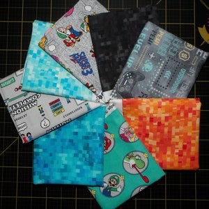 Mario Gaming Fat Quarter Bundle - 8 Piece Mario and Nintendo Gaming Themed FQ Bundle including 4 Pixel Blenders to Match - 100% cotton woven