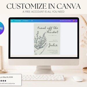 A computer monitor displaying a bridal shower invitation template in Canva with a decorative vase and flowers on the desk.