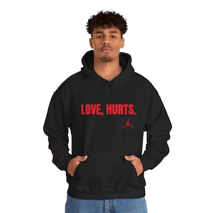 Love Hurts Unisex Heavy Blend Hoodie - Cozy Sweatshirt for Comfort, Casual Style, Gift for Friends, Perfect for Everyday Wear