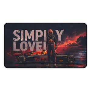 May include: A rectangular desk mat featuring a Formula 1 race car and a driver in a racing suit standing in front of it. The text SIMPLY LOVELY is printed in large white letters. The background shows a dark, fiery sunset with orange and red clouds.