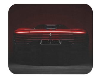 May include: A red sports car with a glowing red light bar across the rear. The car's silhouette is visible against a dark background, with the Ferrari logo centered. The image is a mousepad.