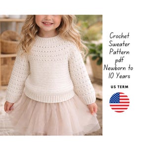 May include: A cream-colored crochet sweater with long sleeves and a round neckline. The sweater is paired with a light pink tulle skirt. Text on the right says "Crochet Sweater Pattern pdf Newborn to 10 Years US TERM".
