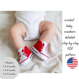 May include: A pair of red and white crochet baby sneakers. The sneakers have a high-top design with white laces and a black stripe on the sole. The image includes text that says "Newborn", "0-3 months", "3-6 months", and "6-9 months".