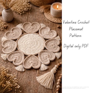 May include: A beige crochet placemat with heart-shaped accents and tassels. The placemat is surrounded by heart-shaped coasters. The image text reads "Valentine Crochet Placemat Pattern Digital only PDF."