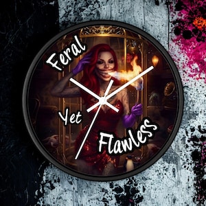 May include: A round wall clock with a black frame featuring an illustration of a person with red hair, a wide grin, and purple gloves holding a torch inside a cage. The text Feral Yet Flawless is printed in white across the clock face with white hands.