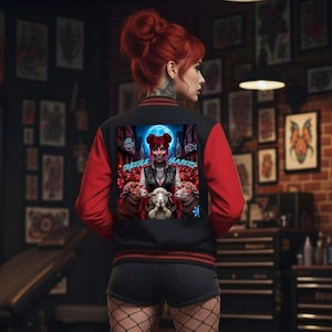 May include: Black and red varsity jacket with a graphic on the back. The graphic features a woman with red hair and the text "SHEEPLE HATERS" above a group of sheep. The jacket has red sleeves and black body.