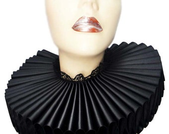 May include: A black ruffled collar with a lace trim. The collar is made of satin and is pleated to create a dramatic look.