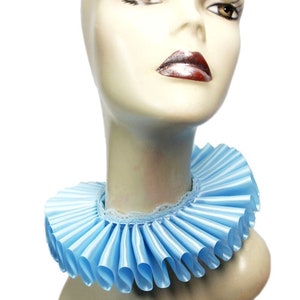 May include: A light blue satin ruffle collar with a white lace trim. The collar is worn by a mannequin with a neutral expression.