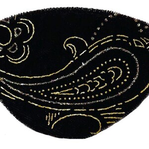 May include: Black eye patch with a gold paisley design. The eye patch is made of velvet and has a soft, comfortable feel.
