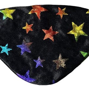 May include: A black eye patch featuring a repeating pattern of multi-colored, metallic-finish stars in shades of yellow, orange, red, blue, purple, and green. The patch is curved in shape and includes a thin black elastic strap on each side.