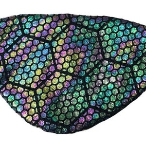 May include: A black eye patch with a holographic hexagonal pattern in shades of green, purple and blue.