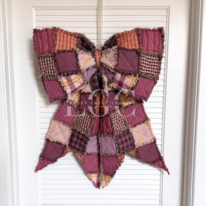 May include: A set of three ceramic mugs with a speckled, matte finish. The mugs are in shades of cream, light gray, and dark gray. Each mug has a simple, minimalist design, perfect for coffee or tea.