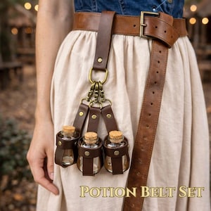 May include: A brown leather belt set with three small glass bottles, each secured in a leather holder. The bottles have cork stoppers. The text "POTION BELT SET" is visible at the bottom of the image.
