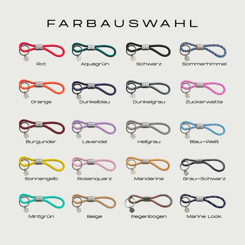 Puede incluir: Una selecci&oacute;n de llaveros en varios colores, incluyendo rojo, verde, negro y azul. Cada llavero presenta un dise&ntilde;o de bucle con un cierre de metal y un peque&ntilde;o dije. El texto "FARBAUSWAHL" est&aacute; en la parte superior.