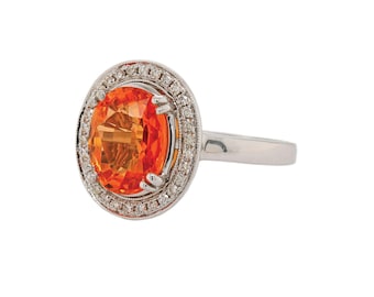 Oval Mandarin Orange Garnet and Diamond Halo Ring
