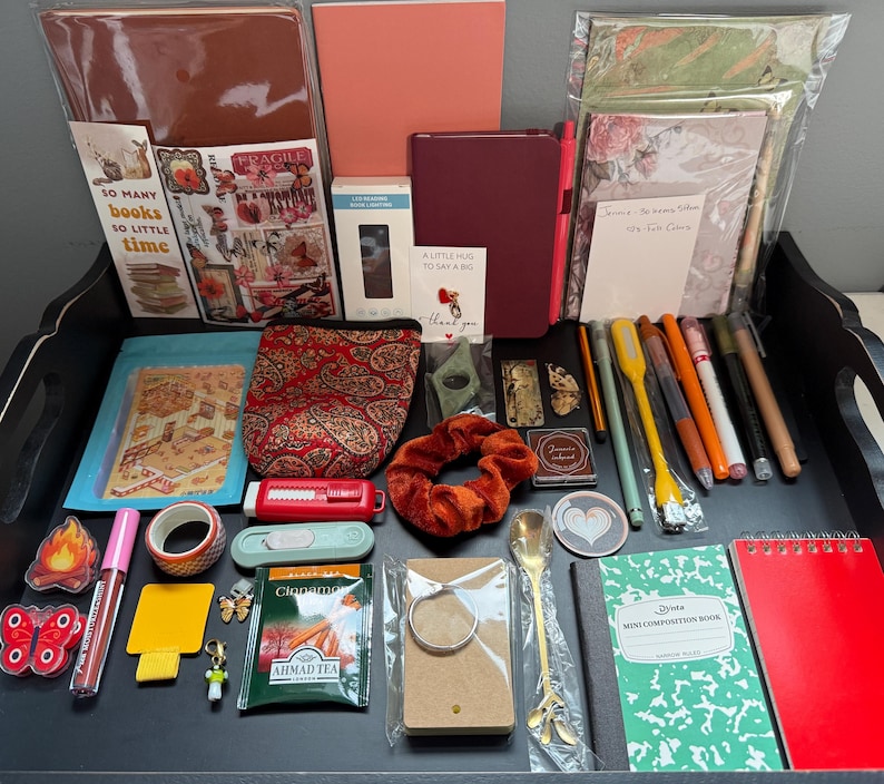Everything But the Book means that you will receive the accessories you would love to have while Reading, Journaling, Scrapbooking, Note taking and so much more without receiving the actual Book. Picture above shows an example of what a mystery bookish bundle looks like.