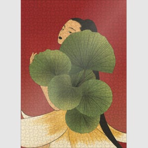 May include: A completed jigsaw puzzle featuring an art deco style illustration. A woman with black hair and a pale complexion is partially visible, holding large green fan-shaped leaves against a red background. The woman is wearing a yellow dress.