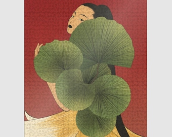 May include: A completed jigsaw puzzle featuring an art deco style illustration. A woman with black hair and a pale complexion is partially visible, holding large green fan-shaped leaves against a red background. The woman is wearing a yellow dress.