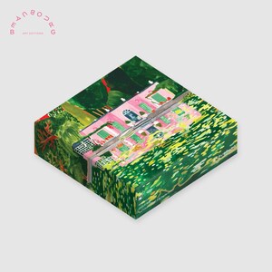 May include: A colorful art box featuring a pink house with green shutters and a lush green landscape. The box has the text "BEAUBOURG ART EDITIONS" in pink. The artwork is vibrant and detailed, with a focus on the house and surrounding foliage.