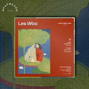 May include: A puzzle box with a red background featuring the text "Lea Woo" and "BEAUBOURG". The puzzle is 1000 pieces and measures 50x70cm. The artwork is titled "Secret Talk" by Lea Woo. The image on the box depicts two figures under a large green leaf.
