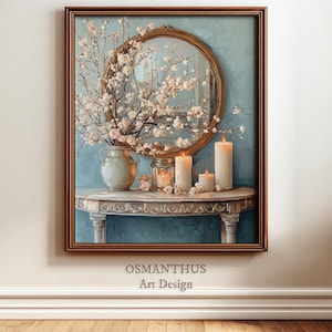 May include: A framed artwork featuring a still life with a mirror, vase of flowers, and candles. The artwork has a blue background and a brown frame. The text "OSMANTHUS Art Design" is at the bottom.