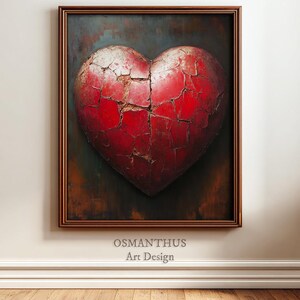 May include: A framed artwork featuring a large, textured red heart with a cracked surface. The heart is set against a dark, mottled background with brown and green hues. The frame is a warm brown color. The text "OSMANTHUS Art Design" is at the bottom.