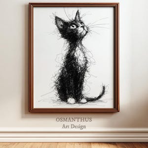 Könnte beinhalten: Ein gerahmter Kunstdruck mit einer schwarz-weißen Skizze einer Katze. Die Katze ist in einem gekritzelten Stil gezeichnet und blickt nach oben. Der Rahmen ist braun, und der Text "OSMANTHUS Art Design" ist sichtbar.