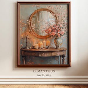 Puede incluir: Una obra de arte enmarcada representa un espejo redondo sobre una mesa con velas y flores. La obra presenta un marco marrón, un espejo redondo y una mesa con un diseño floral. La paleta de colores incluye rosas suaves, verdes y marrones, creando un ambiente cálido.