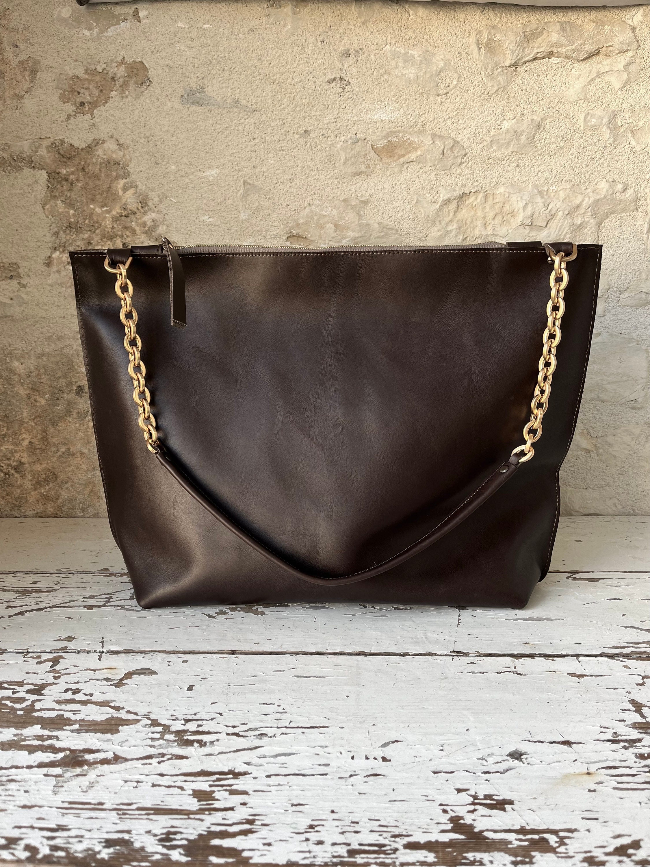 Black leather bag with gold chain hot sale