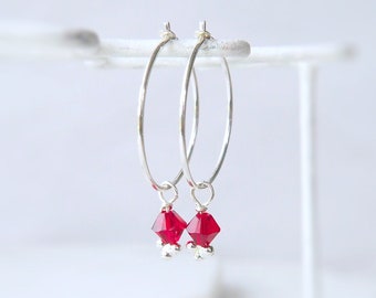 January Birthday Birthstone Gift. Simple Silver Boho Hoops with Red Crystal Dropper Charm.