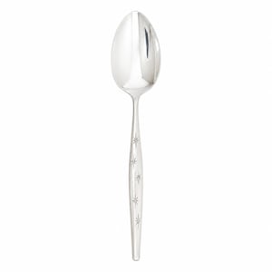 May include: A polished silver-tone metal spoon featuring a smooth, rounded bowl and a tapered handle. The handle is decorated with a vertical row of five small, engraved starburst patterns, each consisting of thin lines radiating from a central point.