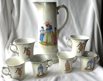 Jarra y 6 tazas de cerámica antigua Roseville, estilo holandés, de color crema, anteriores a 1916.
