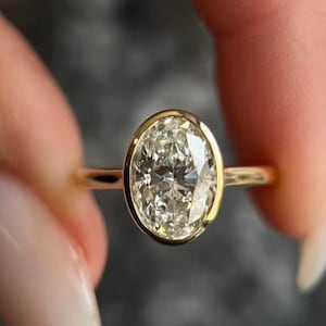 2CT Oval Cut Solitaire Ring | IGI Certified Lab Diamond With Cathedral Shank & Bezel Setting | 14k Yellow Gold Engagement Ring