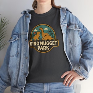 Dino Nugget Park T-Shirt, Unisex Heavy Cotton Tee, Fun Dino Shirt, Kid-Friendly Apparel, Family Outing Top, Dinosaur Lovers Gift