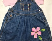 One of a kind baby jean dress, one size only 6-12 months on dress with hand painted flowers
