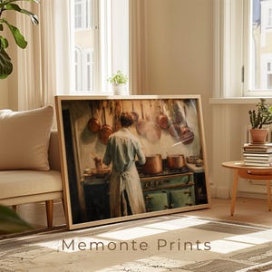 May include: A framed print of a kitchen scene with a chef at work. The artwork features copper pots, a green stove, and a warm color palette. The text "Memonte Prints" is visible at the bottom of the frame.