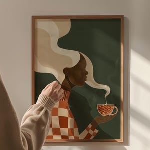 May include: A framed art print featuring a stylized illustration of a person holding a cup of coffee. The person has dark skin and long, flowing white hair. The person is wearing a red and orange checkered top. The background is dark green.