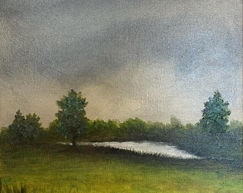 May include: An oil painting of a landscape featuring a green field, a line of trees, and a cloudy sky. The painting has a square format and is signed in the bottom right corner. The color palette includes shades of green, gray, and yellow.