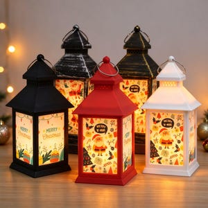 May include: Four decorative lanterns in black, red, and white, each featuring a top handle and translucent panels printed with colorful Christmas motifs, including Santa Claus, pine trees, gift boxes, and the text Merry Christmas.
