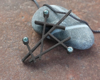 Green sapphire and oxidized silver pendant