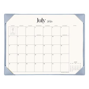 May include: A desk calendar for July 2026 featuring a cream-colored page with a black grid, blue corner protectors, and a small August 2026 calendar in the bottom right corner. The text includes the month, year, days of the week, and dates.
