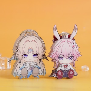 May include: A set of three ceramic mugs with a speckled, matte finish. The mugs are in shades of cream, light gray, and dark gray. Each mug has a simple, minimalist design, perfect for coffee or tea.