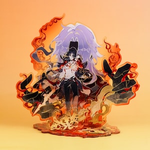May include: An acrylic standee featuring a character with long light purple hair, wearing a white shirt and dark pants, surrounded by translucent orange and red flame-like elements and dark rock-like shapes, set on a matching decorative base.