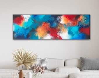 Puede incluir: Pintura de arte abstracto con una vibrante mezcla de colores. La obra presenta pinceladas audaces en tonos de azul, rojo, naranja y blanco, creando una composición dinámica y enérgica. El lienzo rectangular está enmarcado en un borde plateado, adecuado para la decoración del hogar.