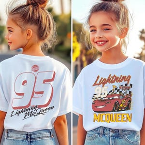 May include: White t-shirt featuring Lightning McQueen from the Cars movie. The front of the shirt displays a graphic of the character with the text "Lightning McQueen 95". The back of the shirt has the number "95" and the text "Lightning McQueen".