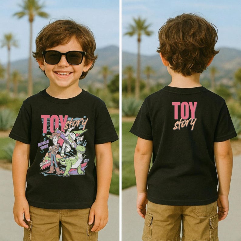 May include: Black t-shirt featuring a colorful graphic of Toy Story characters, including Woody and Buzz Lightyear, with the text "TOY STORY" and "SINCE 1995". The back of the shirt displays the text "TOY story" in pink and white.