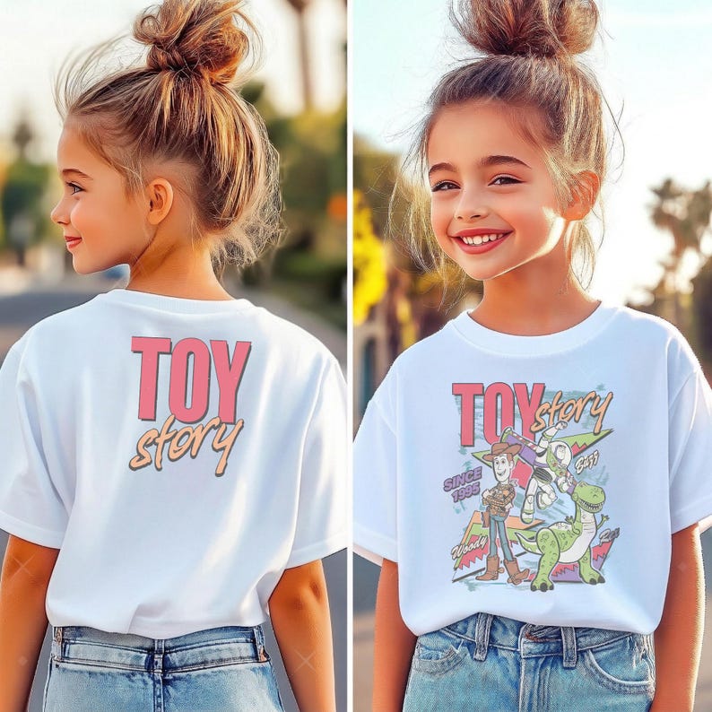 May include: White t-shirt featuring the text "TOY STORY" in pink and orange. The front of the shirt has a graphic of characters from the movie, including Woody, Buzz Lightyear, and Rex. The shirt is worn by a young person.