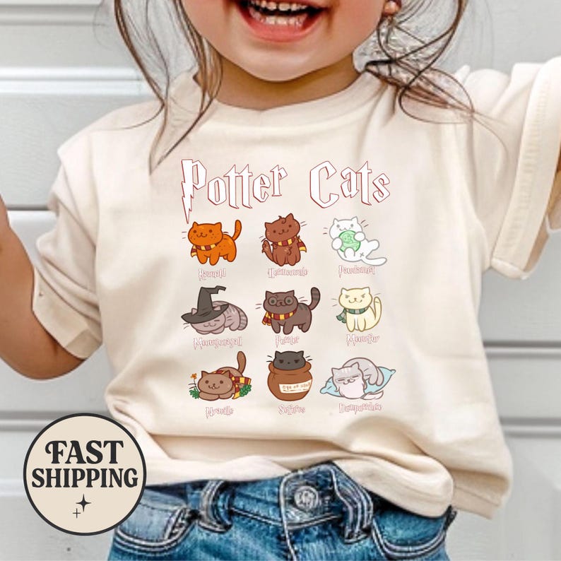 May include: Cream-colored t-shirt featuring the text "Potter Cats" above nine cartoon cat illustrations. Each cat is depicted in a different pose and color, with various accessories. A round "Fast Shipping" graphic is at the bottom.