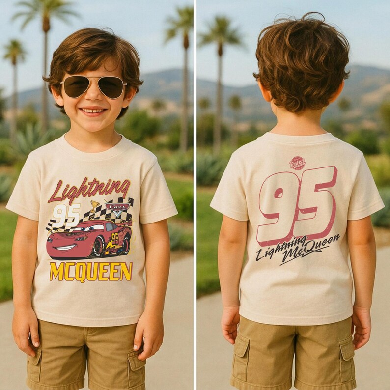 May include: Tan t-shirt featuring Lightning McQueen from the Cars movie. The front of the shirt displays the text "Lightning 95 McQueen" with a graphic of the race car. The back of the shirt has a large "95" and "Lightning McQueen" text.