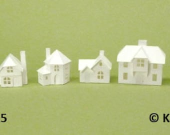 Tiny Village 2015, pre-cut kit to make 8 miniature cardstock buildings. 3 color choices